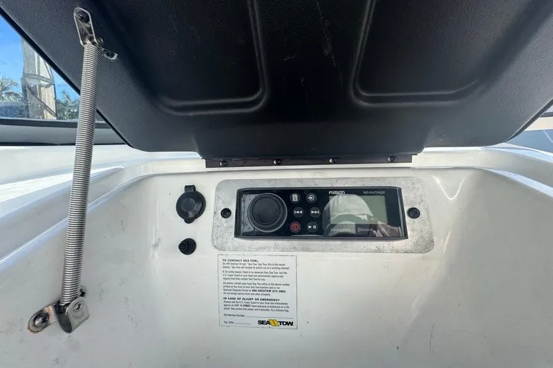 Slide: The Image of 2012 Yamaha Boats SX190 dashboard with Fusion stereo system and Sea Tow contact information. - 25