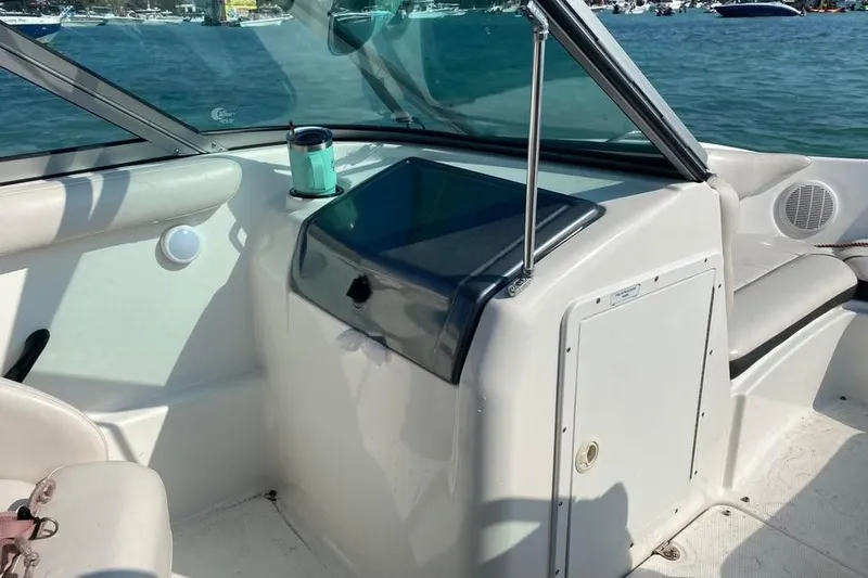 Slide: The Image of 2012 Yamaha Boats SX190 docked in sunny marina, surrounded by palm trees and other boats. - 3