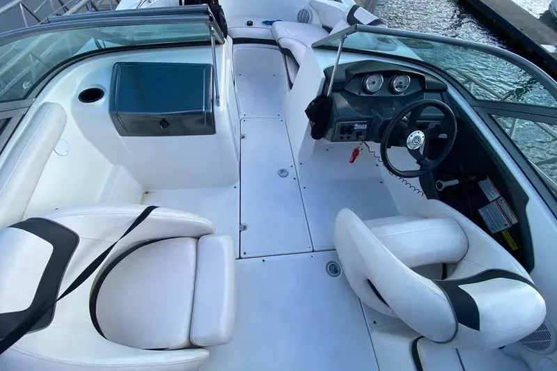 Slide: The Image of 2012 Yamaha Boats SX190 with white interior docked in marina. - 6
