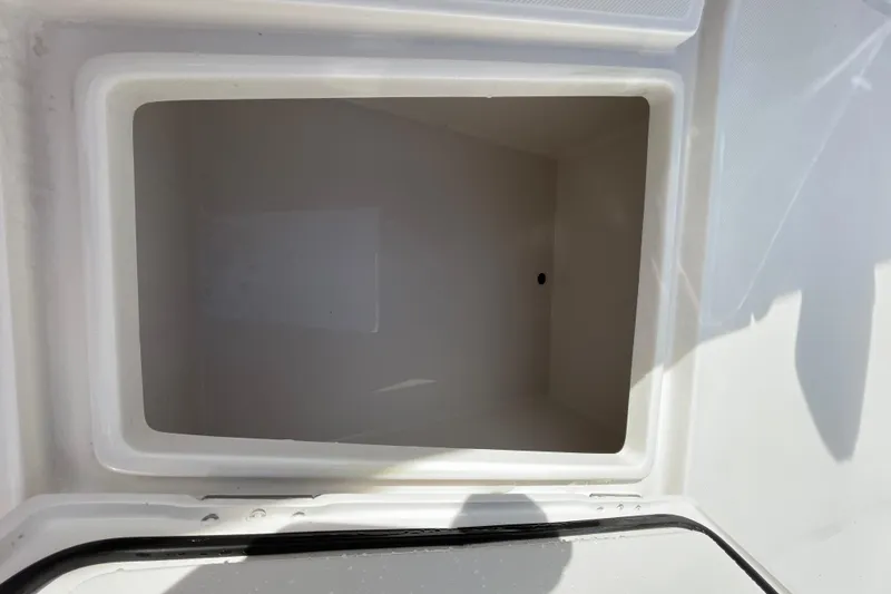 Slide: The Image of Open storage compartment on a 2020 Jupiter 34 Center Console boat. - 18