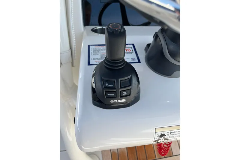 Slide: The Image of Yamaha joystick control on 2020 Jupiter 34 Center Console boat dashboard. - 21