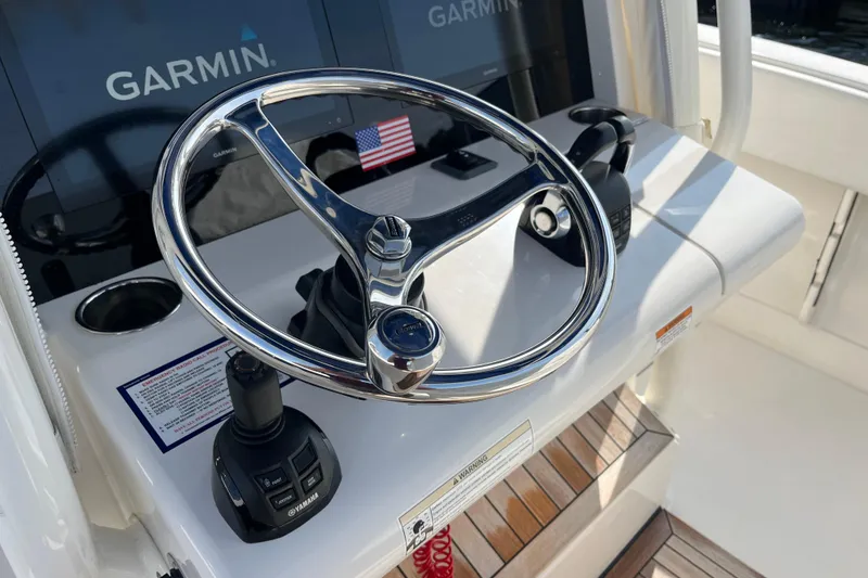 Slide: The Image of Steering wheel of 2020 Jupiter 34 Center Console with Garmin navigation system. - 23