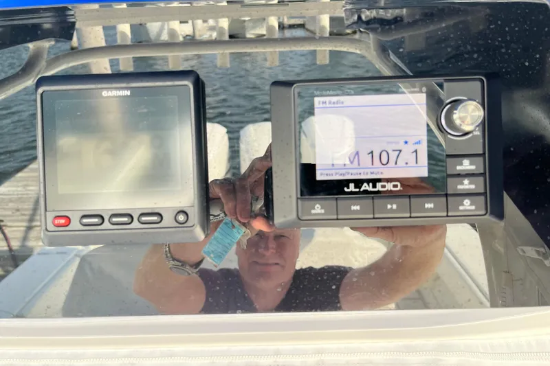 Slide: The Image of Console of 2020 Jupiter 34 Center Console with Garmin and JL Audio displays. - 27