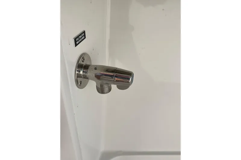 Slide: The Image of Saltwater washdown outlet on 2020 Jupiter 34 Center Console boat. - 29