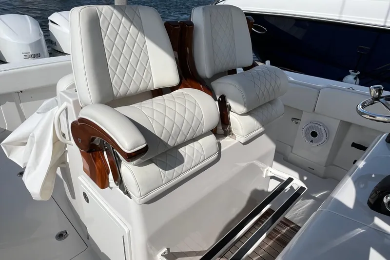 Slide: The Image of Luxurious seating on 2020 Jupiter 34 Center Console boat with white quilted upholstery. - 31