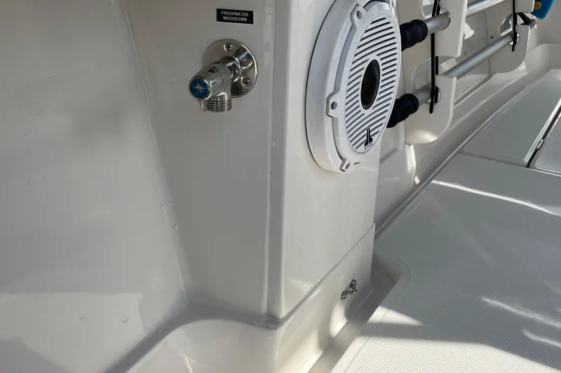 Slide: The Image of 2020 Jupiter 34 Center Console boat interior with freshwater washdown and speaker. - 34