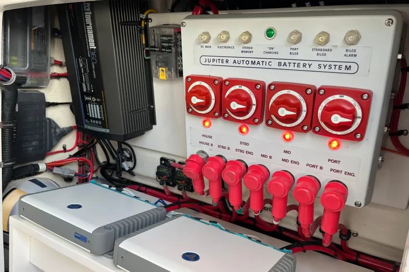 Slide: The Image of 2020 Jupiter 34 Center Console automatic battery system with control panel and wiring. - 44