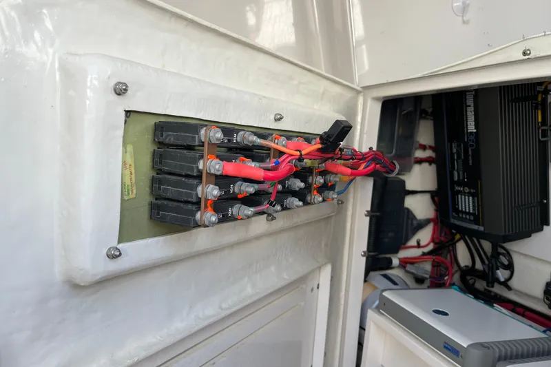 Slide: The Image of Electrical panel inside 2020 Jupiter 34 Center Console boat, showcasing wiring and components. - 45