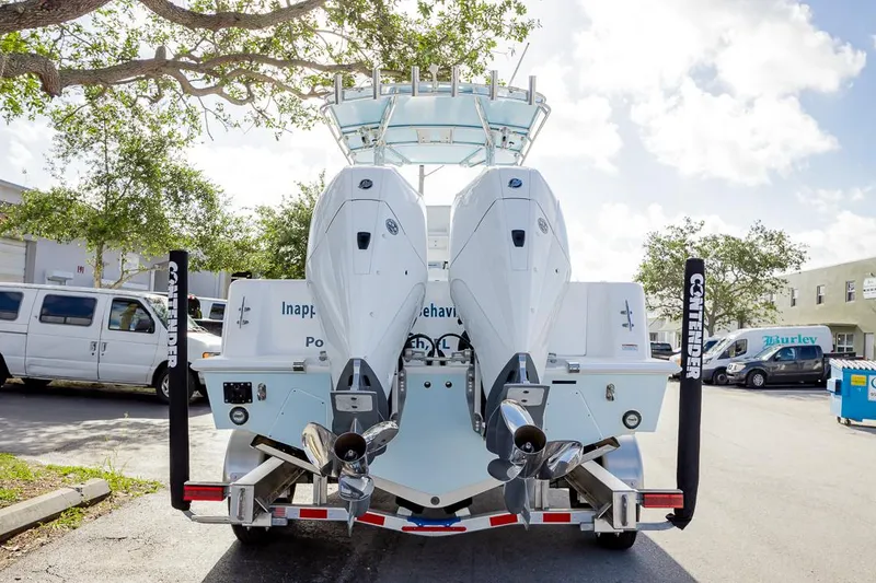 Slide: The Image of 2024 Contender 28 Tournament boat with dual engines on a trailer. - 14