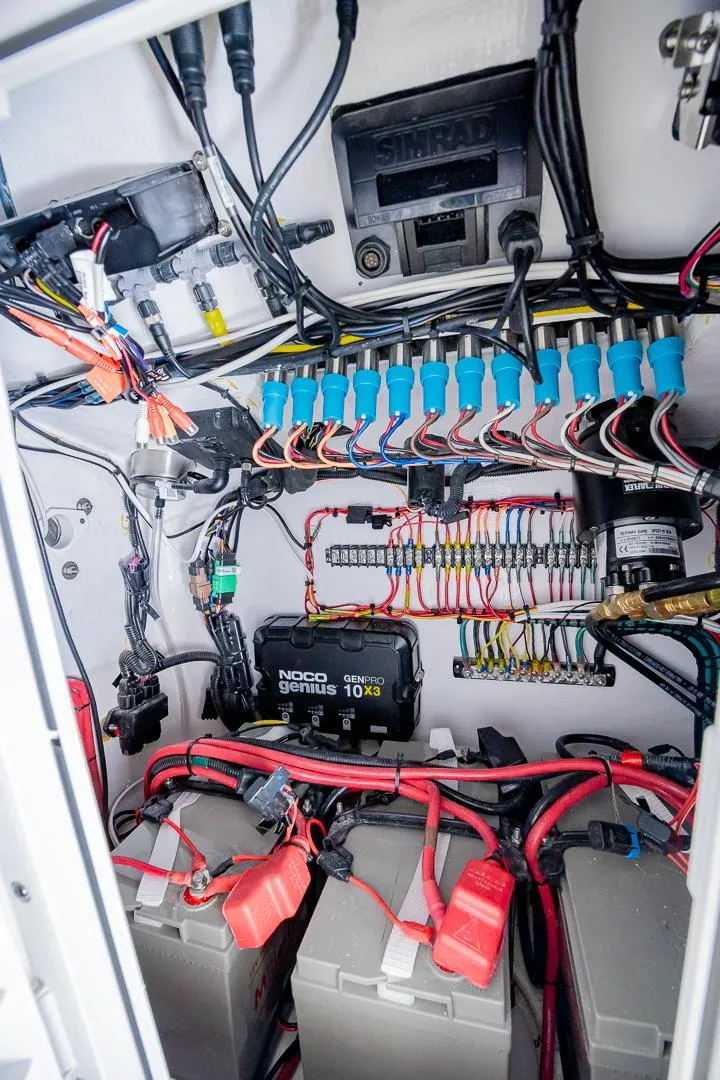 Slide: The Image of Electrical wiring and components inside a 2024 Contender 28 Tournament boat. - 17