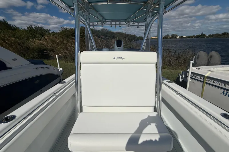 Slide: The Image of 2024 Contender 28 Tournament boat interior with white seating and blue canopy. - 29