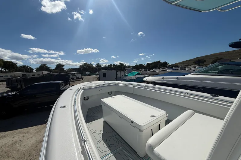 Slide: The Image of 2024 Contender 28 Tournament boat, spacious deck, sunny day, marina background. - 30