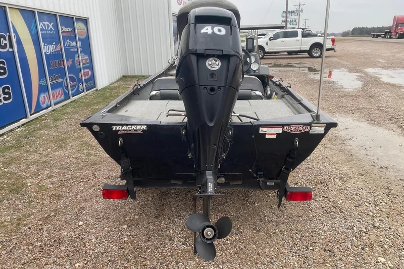 Slide: The Image of 2018 Tracker Pro 160 boat with 40 HP motor, parked on gravel. - 5