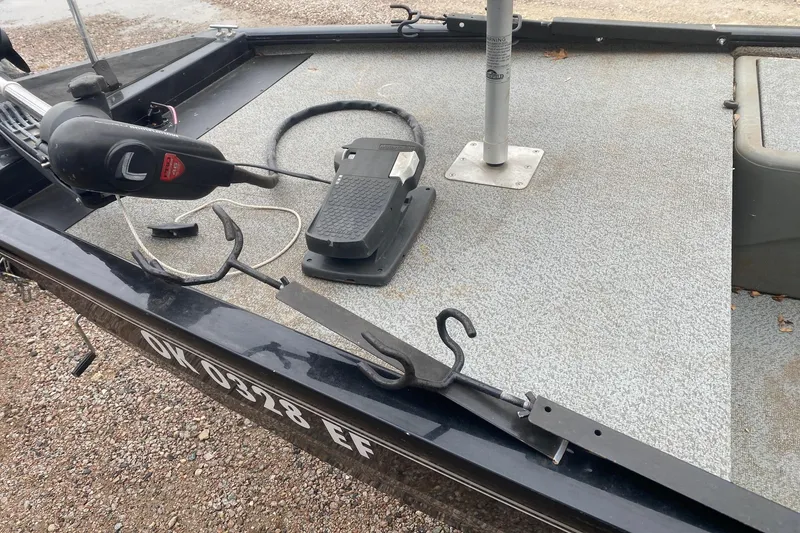 Slide: The Image of 2018 Tracker Pro 160 boat deck with trolling motor and foot pedal. - 8