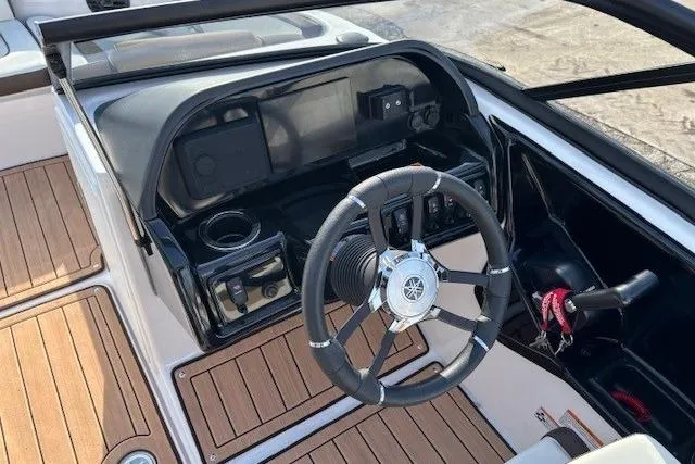 Slide: The Image of 2023 Yamaha Boats 195S cockpit with steering wheel and dashboard controls. - 15