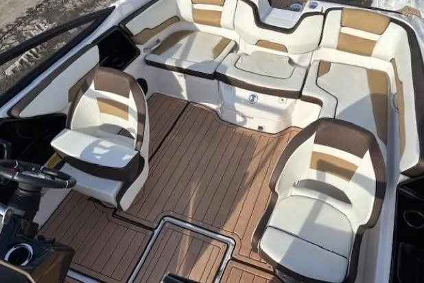 Slide: The Image of 2023 Yamaha Boats 195S interior with stylish seating and wood-like flooring. - 21