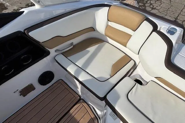 Slide: The Image of 2023 Yamaha Boats 195S interior with beige and white seating, showcasing luxury design. - 24