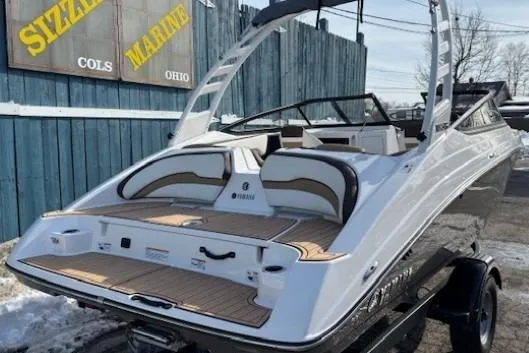 Slide: The Image of 2023 Yamaha Boats 195S, sleek design, parked outdoors at Sizzle Marine, Ohio. - 3