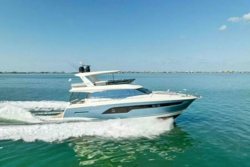 The Image of 2019 Prestige 630 yacht cruising on open water. - 0