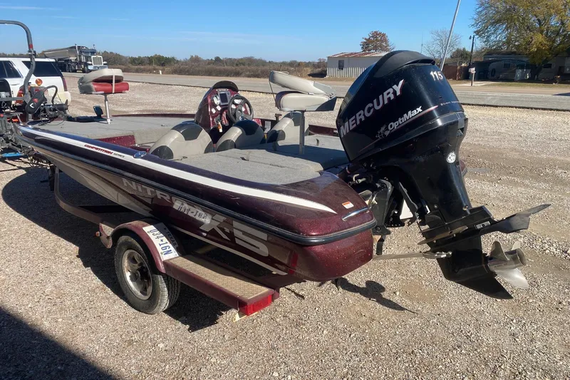 Slide: The Image of 2009 Nitro X-5 boat with Mercury OptiMax engine on a trailer. - 4
