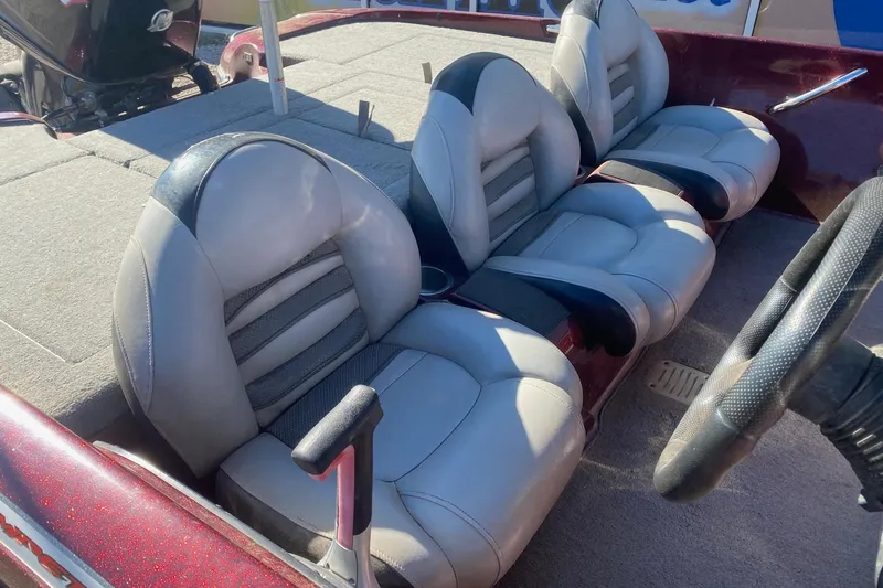 Slide: The Image of Interior of a 2009 Nitro X-5 boat with gray leather seats and steering wheel. - 8