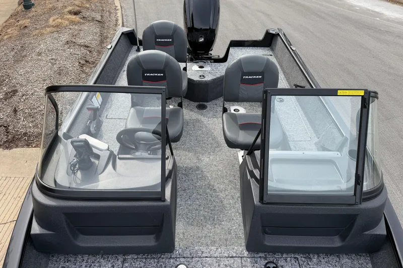 Slide: The Image of 2026 Tracker Pro Guide V-16 WT boat interior with seating and windshield. - 50