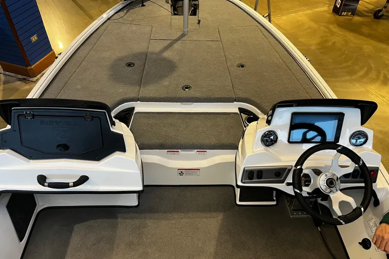 Slide: The Image of 2026 Nitro Z19 XL Pro boat interior with steering wheel and dashboard controls. - 92