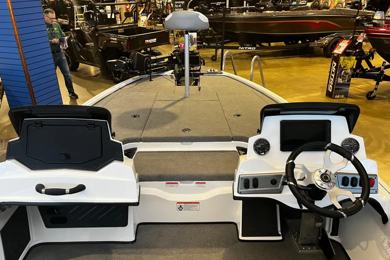 Slide: The Image of 2026 Nitro Z19 XL Pro boat interior with steering wheel and dashboard controls. - 93