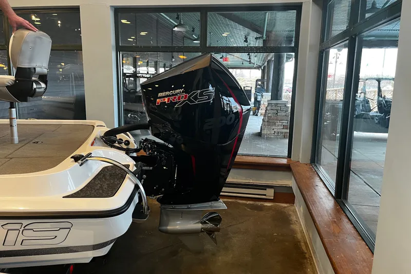 Slide: The Image of 2026 Nitro Z19 XL Pro boat with Mercury Pro XS engine displayed indoors. - 94