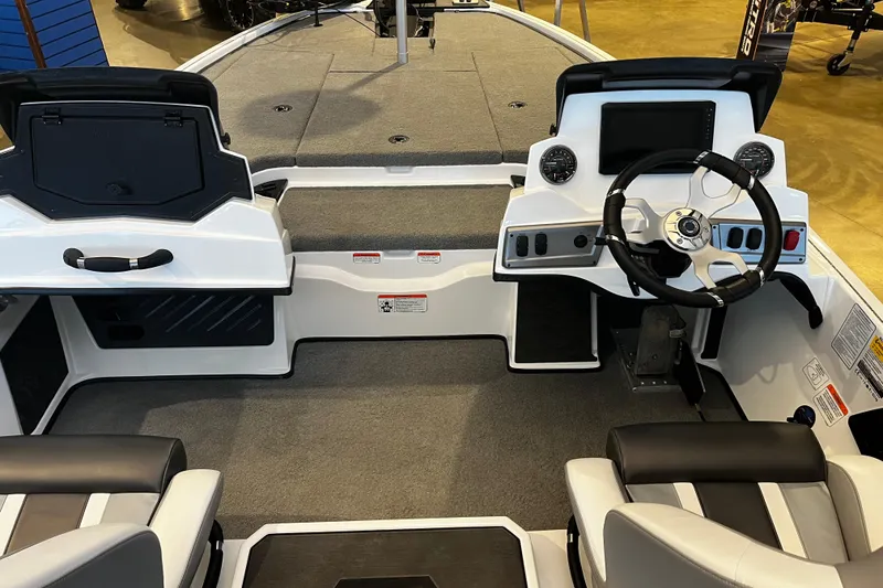 Slide: The Image of 2026 Nitro Z19 XL Pro boat interior with steering wheel and seating. - 96
