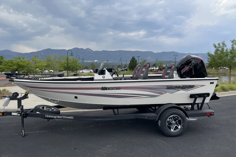 The Image of 2026 Ranger VS1682SC Angler boat on trailer, parked with scenic mountain backdrop. - 0
