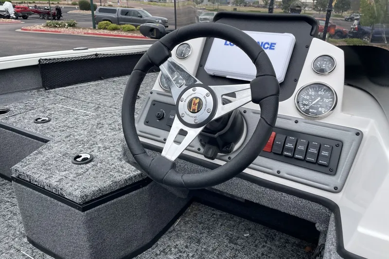 Slide: The Image of 2026 Ranger VS1682SC Angler boat dashboard with steering wheel and control panel. - 79