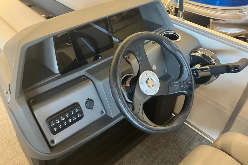 Slide: The Image of 2026 Sun Tracker Party Barge 18 DLX steering console with modern controls and sleek design. - 7