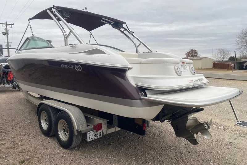 Slide: The Image of 2008 Cobalt 272 boat on trailer, featuring sleek design and dual propellers. - 3