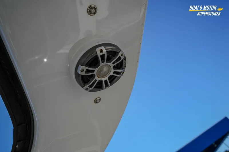 Slide: The Image of 2024 Avalon Twin Quad Lounger Windshield speaker detail against clear blue sky. - 31