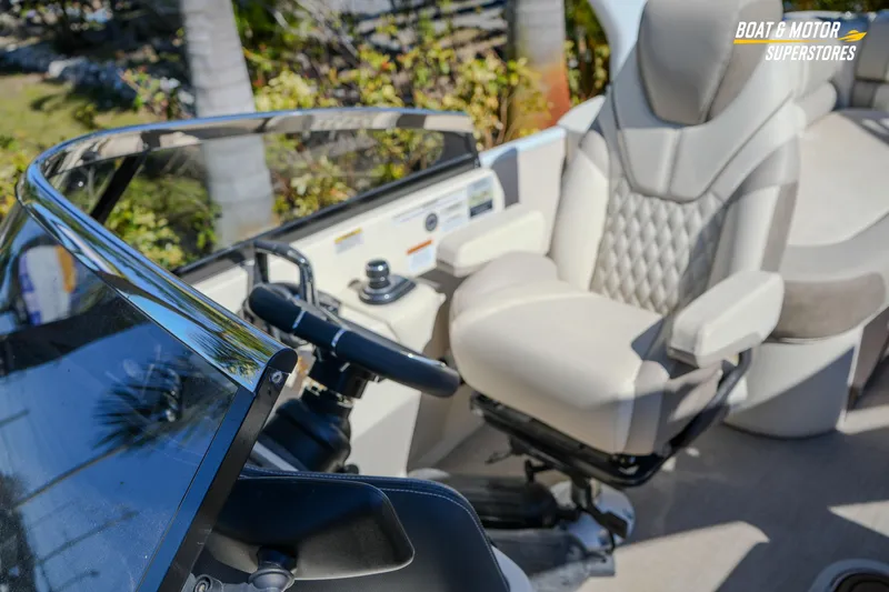 Slide: The Image of 2024 Avalon Twin Quad Lounger Windshield interior with luxurious seating and steering console. - 39