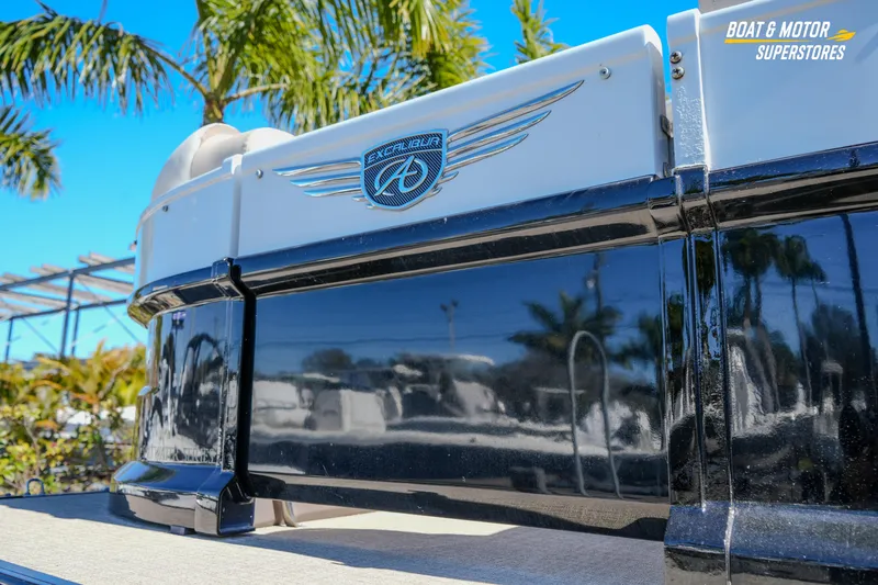Slide: The Image of 2024 Avalon Twin Quad Lounger Windshield boat with sleek design, palm trees in background. - 9