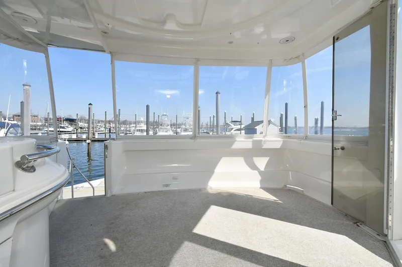 Slide: The Image of Spacious interior of 2001 Carver 466 Motor Yacht with marina view. - 12