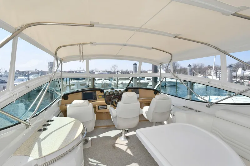 Slide: The Image of Interior view of 2001 Carver 466 Motor Yacht with helm and seating area. - 15