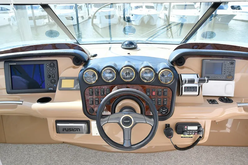 Slide: The Image of Helm of 2001 Carver 466 Motor Yacht with navigation instruments and steering wheel. - 18