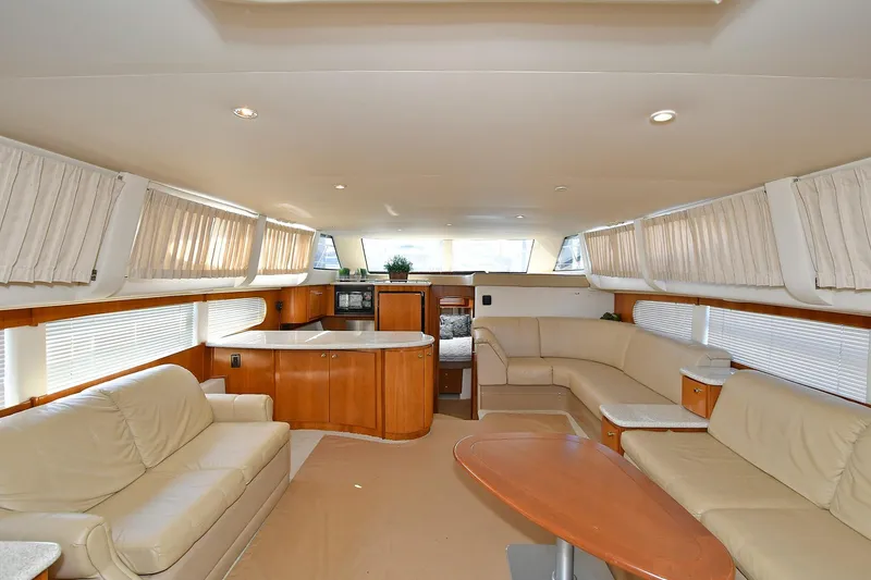 Slide: The Image of Luxurious interior of 2001 Carver 466 Motor Yacht with elegant seating and modern amenities. - 21