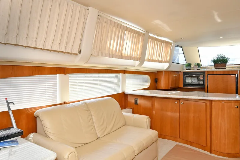 Slide: The Image of Luxurious interior of 2001 Carver 466 Motor Yacht with leather seating and modern kitchen. - 24