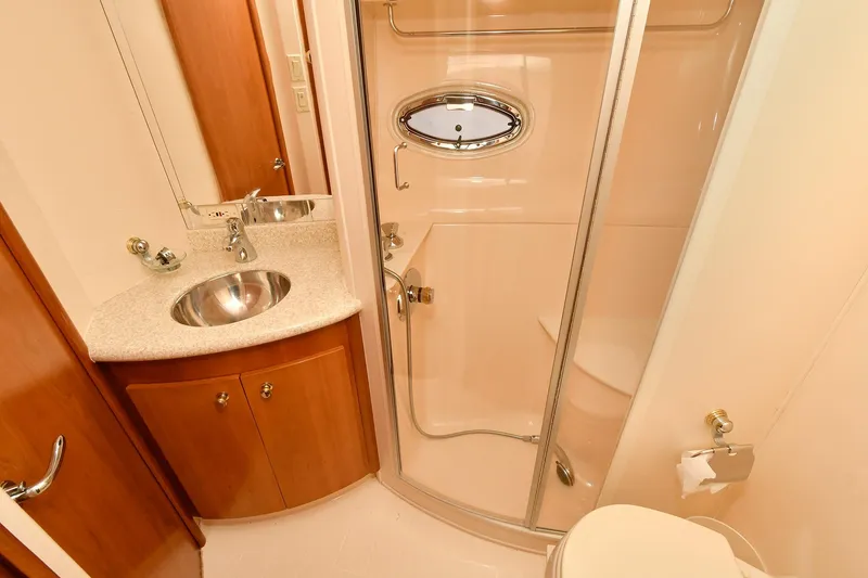 Slide: The Image of Luxurious bathroom in 2001 Carver 466 Motor Yacht with shower and sink. - 35
