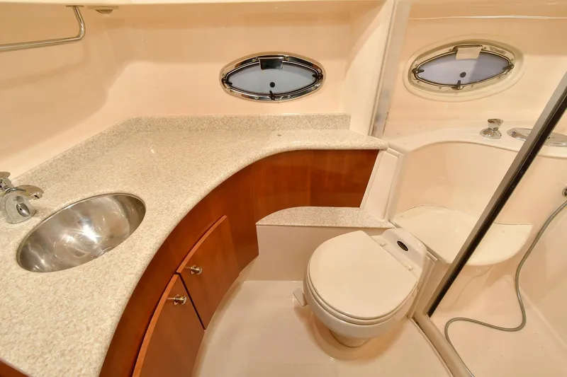 Slide: The Image of Luxurious bathroom in 2001 Carver 466 Motor Yacht with modern fixtures and elegant design. - 39