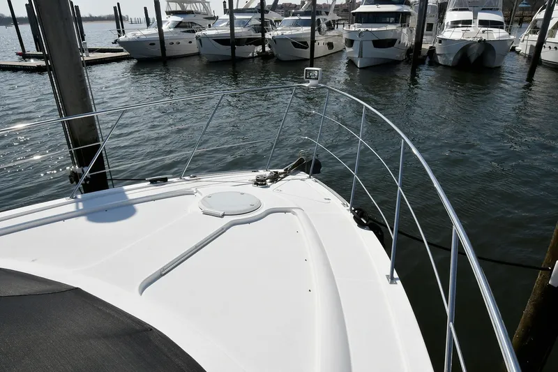 Slide: The Image of Bow view of 2001 Carver 466 Motor Yacht docked at marina. - 8