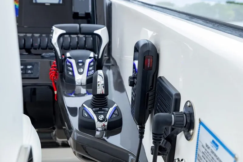 Slide: The Image of 2026 Pursuit DC 286 Dual Console boat controls and dashboard close-up. - 12