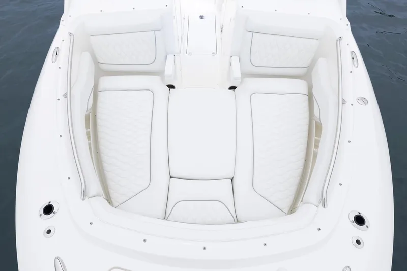 Slide: The Image of 2026 Pursuit DC 286 Dual Console boat with luxurious white seating. - 17