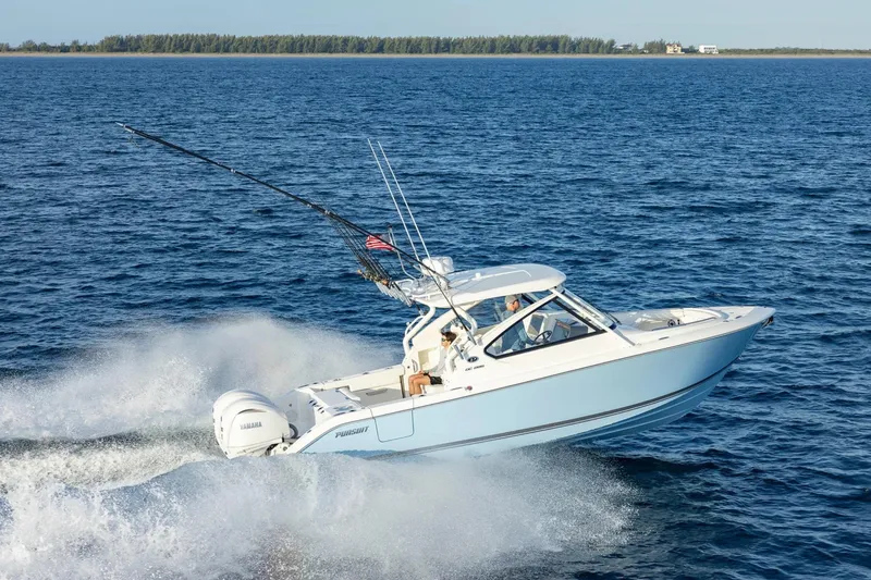 Slide: The Image of 2026 Pursuit DC 286 Dual Console boat cruising on open water. - 2