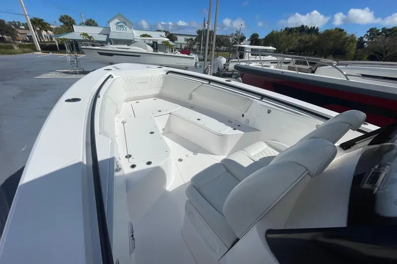Slide: The Image of 2022 Everglades 335 Center Console boat with spacious seating and sleek design. - 26