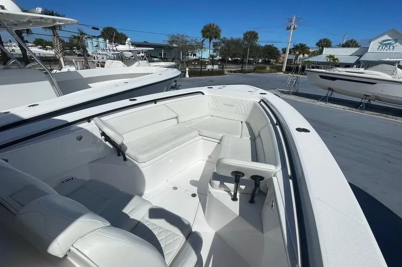 Slide: The Image of 2022 Everglades 335 Center Console boat with spacious seating and sleek design. - 34